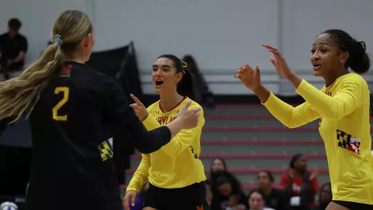 Maryland celebrates a point against Saint Peter's