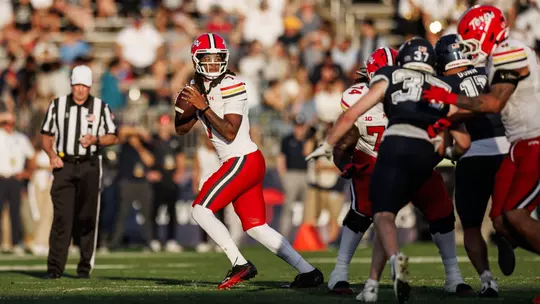 Malik Washington dropping back to pass during Maryland's win at UConn on September 12, 2026