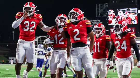 Maryland celebrates an interception against Hampton