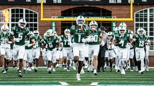 Football team running out of the tunnel