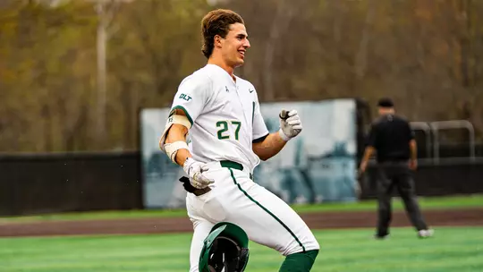 Todd Hudson rounds first after hitting a walk-off