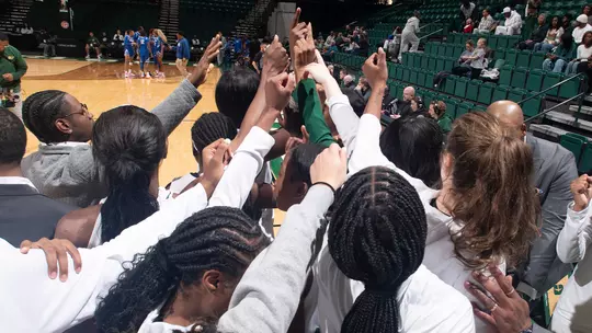Women's basketball team huddle