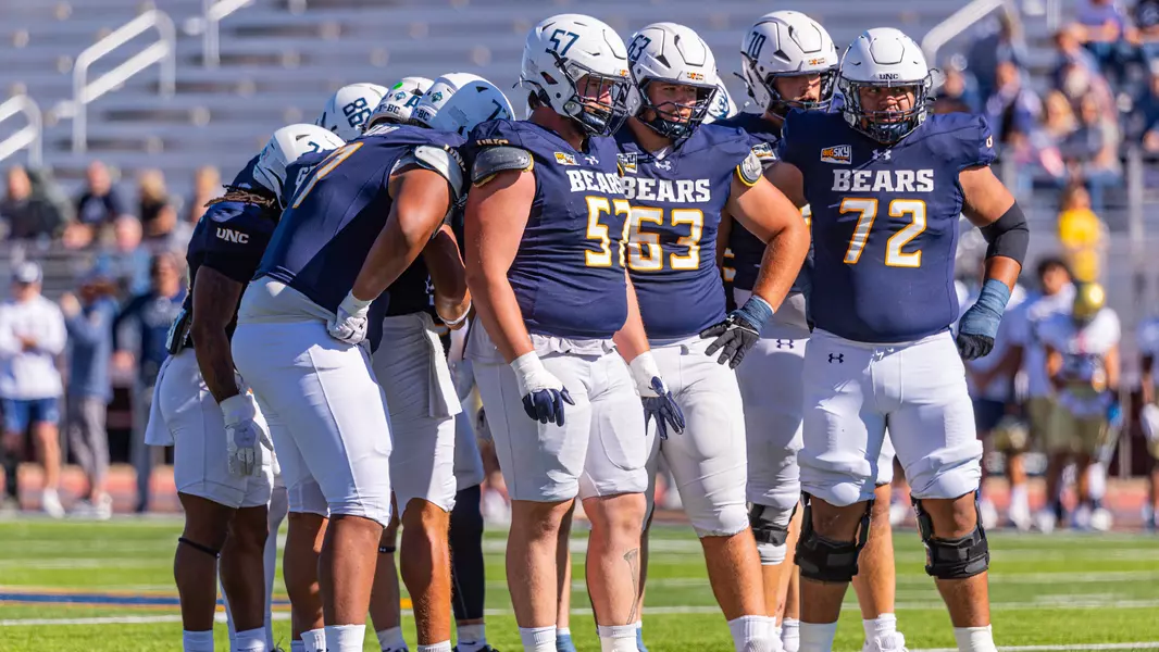 Offensive Line in Huddle against UC Davis