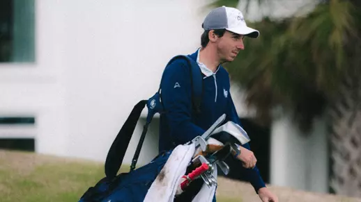 Danny Erickson carrying clubs