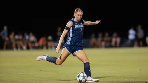 Defender Zoe Looker kicks a ball down the field