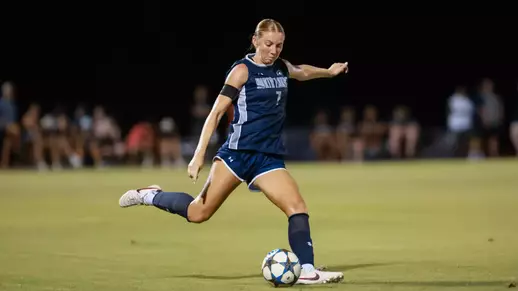 Defender Zoe Looker kicks a ball down the field