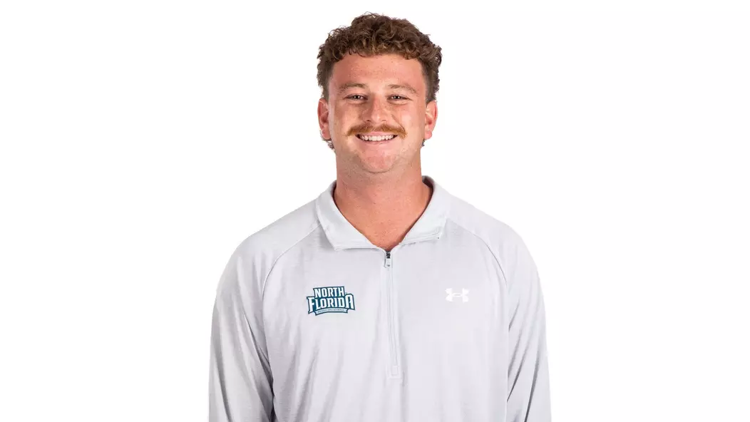 White backdrop photo of Assistant Coach Makai Lipson