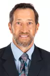 Headshot of Senior Associate Athletic Director/Chief Medical Officer (MBB/MGOLF) Fred Burnett