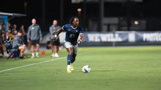 North Florida's Germain Kapela dribbling vs. South Carolina