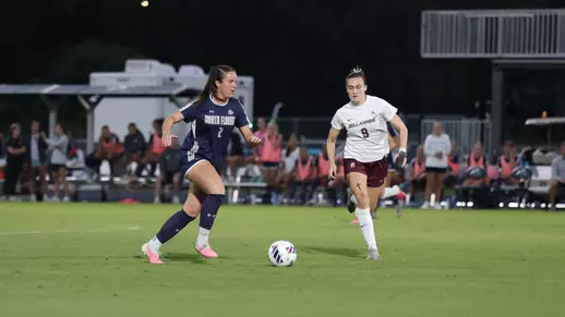 Defender Julia Cosgrove with the ball against Bellarmine