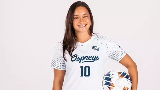 White Backdrop Photo of Paige McSwigan Holding a soccer ball