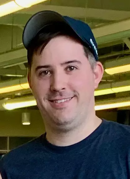 Headshot of UNH swimming and diving assistant coach Derek Peabody
