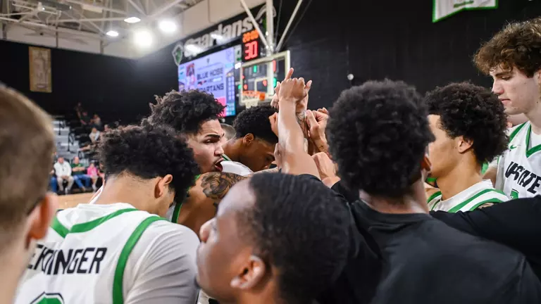 Breylin Garcia leading the huddle against PC
