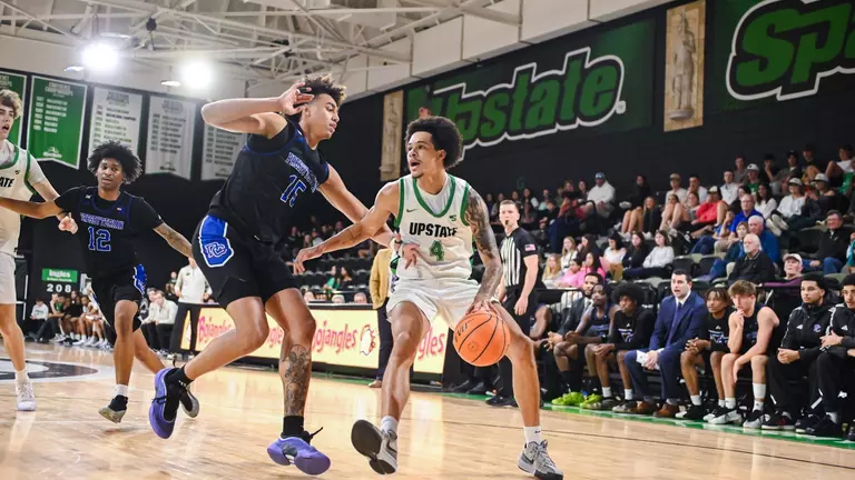 Carmelo Adkins dribbling against PC