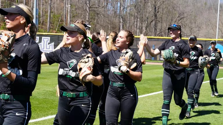 Leanne Allen and Molly Vaughn going through the huddle