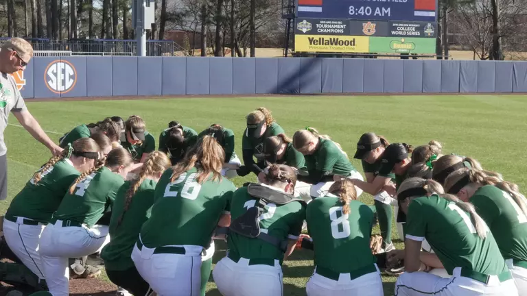 Softball prayer before Auburn Tournament