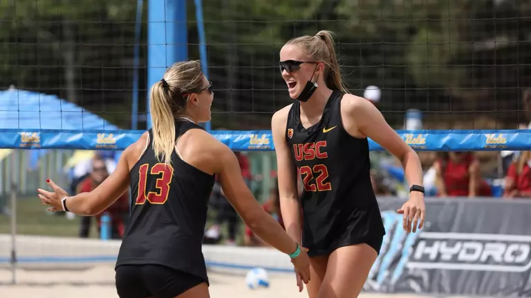 Megan Kraft low fives Hailey Harward