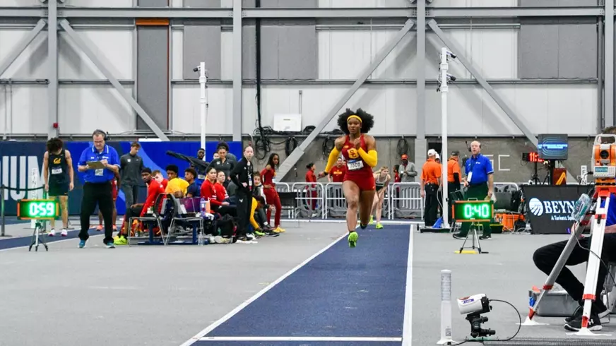 Avery Lewis competing in long jump