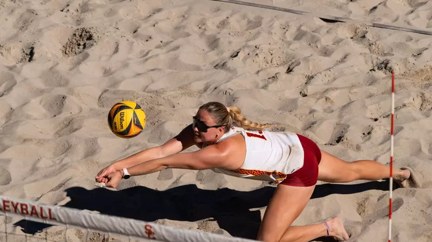 Bella Satterwhite dives for a ball at Merle Norman Stadium
