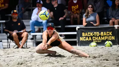 Ashley Pater digs a ball against UCLA