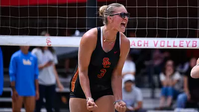 Kennedy Coakley cheers after scoring a point against UCLA