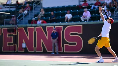 andrin casanova prepares a serve