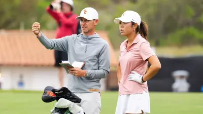 Justin Silverstein instructs Jasmine Koo during the 2026 NCAA Championships