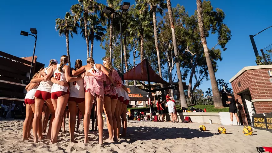 USC beach volleyball huddles at Merle Norman Stadium