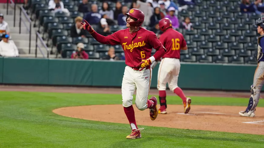 Dean Carpentier reaches home plate after his home run against Nevada.