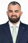 Bryan Hodgson poses for photos on March 28, 2025 before his introductory press conference.
(Stephen Galvin / University of South Florida Athletics)