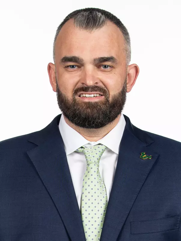 Bryan Hodgson poses for photos on March 28, 2025 before his introductory press conference.
(Stephen Galvin / University of South Florida Athletics)