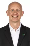 Chris Mack headshot taken on March 30, 2026.