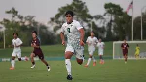 Cadore running down a ball.