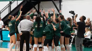 Volleyball team huddle pre match vs TCU