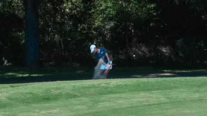 Womens Golfer Swinging