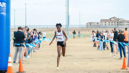 Dorcas Jepkosgei crossing the finish line