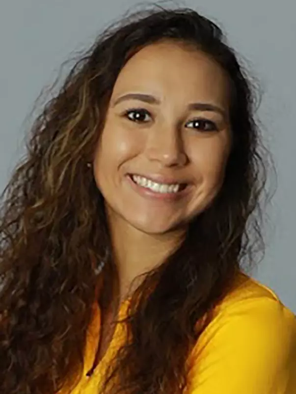 The Women's Golf Team Poses for their action and studio portraits for university marketing in Fetterman Gym.