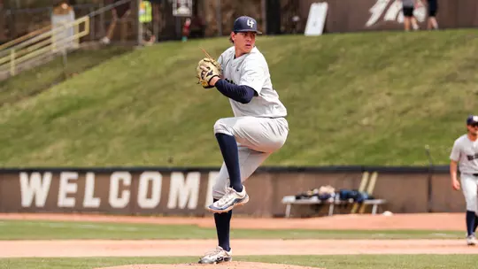 Michael Fliss throws a pitch in a gray uniform