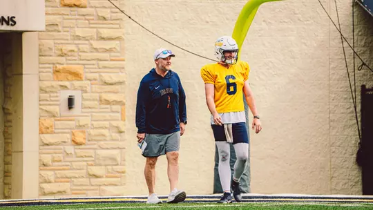 Head Coach Mike Jacobs with John Alan Richter at practice