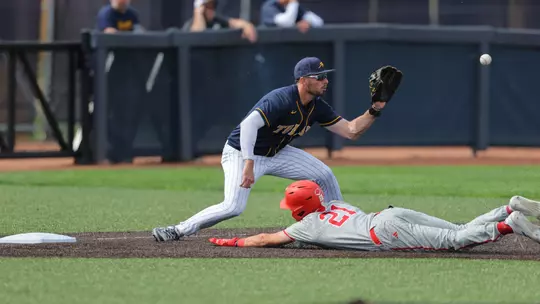 Troy Sudbrook catching a baseball against Miami