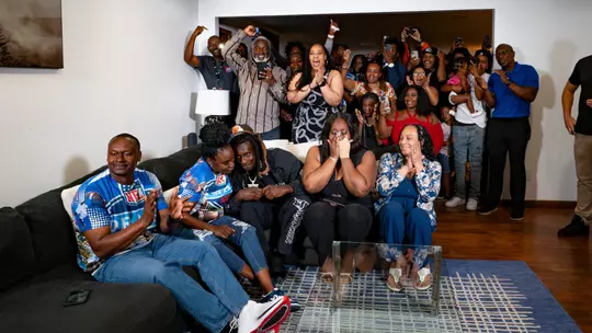 Emmanuel McNeil-Warren celebrates with family and friends on NFL Draft night