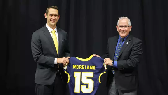 Tom Moreland with President Holloway holding jersey
