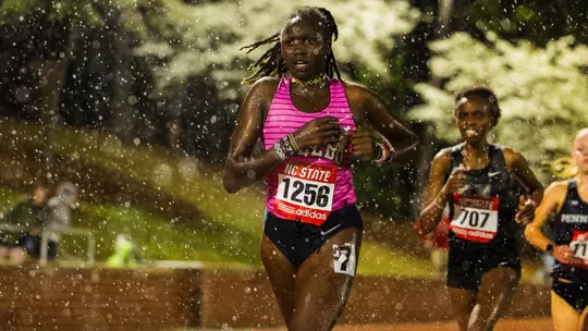 Dorcas Kiptantui running in the rain at the 2026 Raleigh Relays.