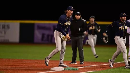 Michael Fliss celebrates getting out of an inning