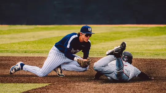 Charlie Scholvin makes a tag on a runner stealing