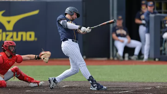 Troy Sudbrook swings a bat against Miami