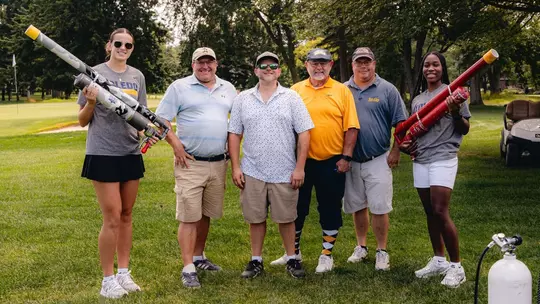 Photo of golfers and Toledo women's basketball players at golf outing