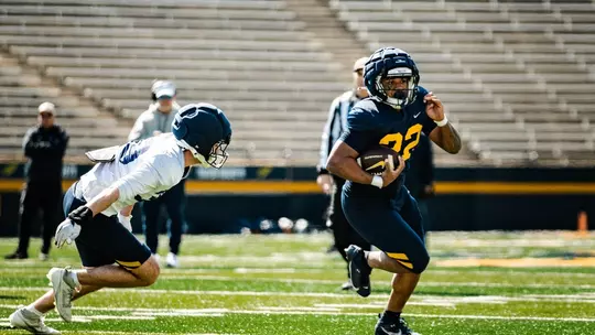 CJ Miller rushing the football