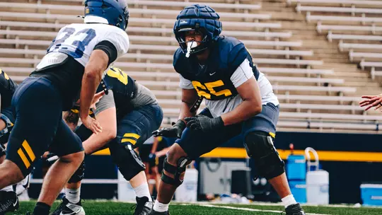 Stephen Gales blocking a teammate in practice