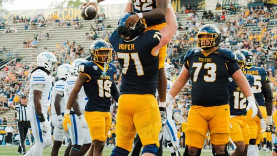Matt Hofer lifts running back CJ Miller after a touchdown